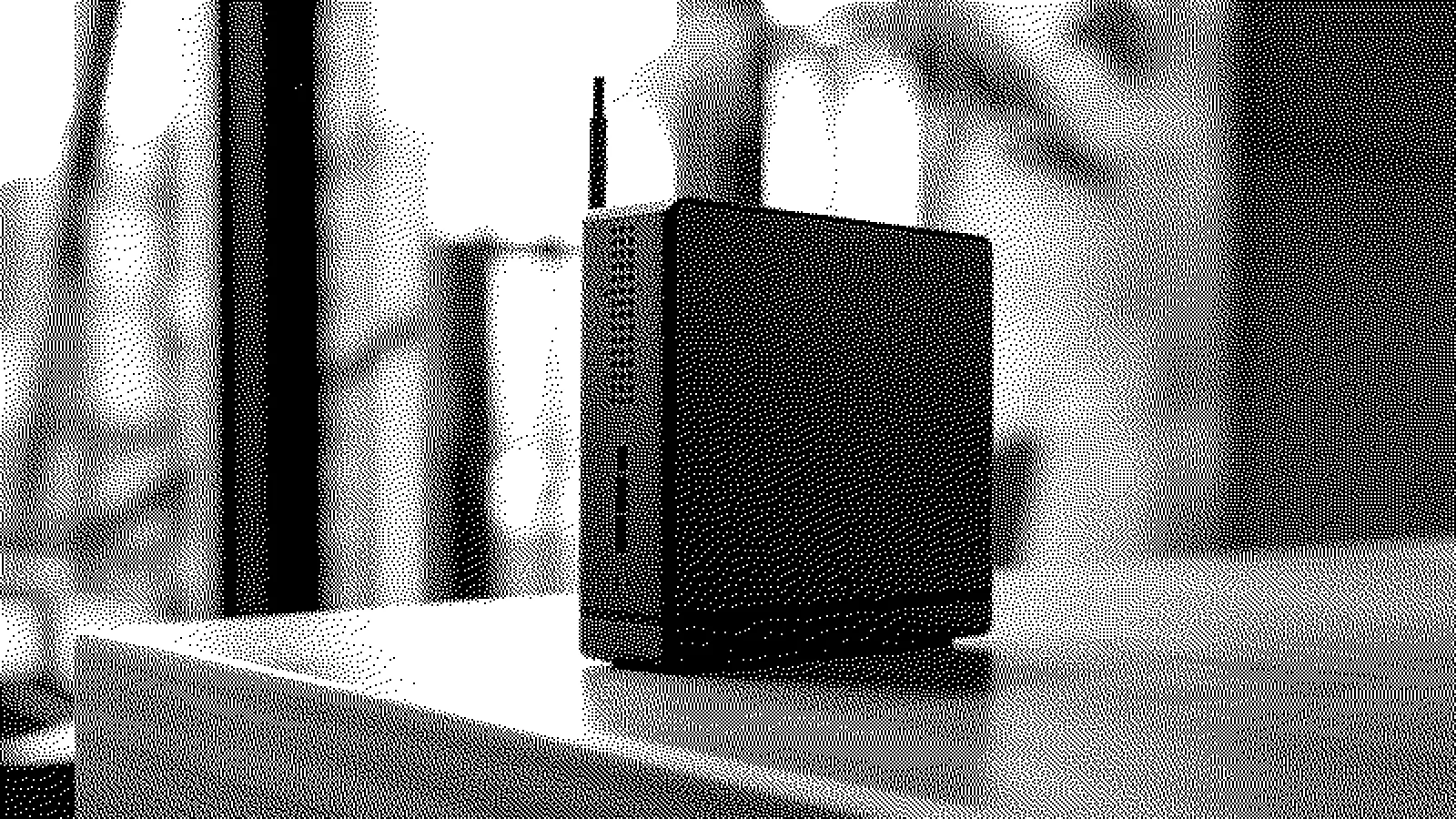 A small mini PC standing on a wooden desk, rendered as a black and white dither